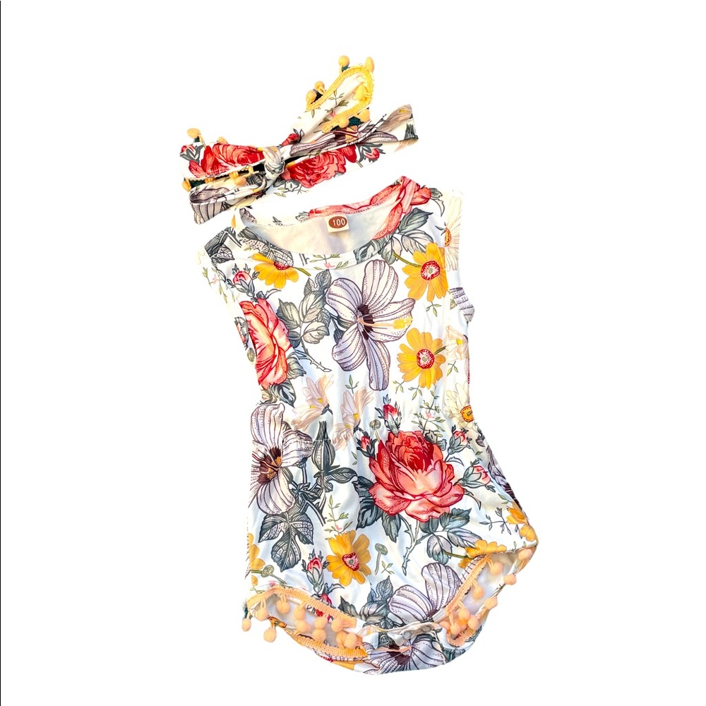 Gorgeous floral onesie with matching adjustable headband & Pom Pom details.
